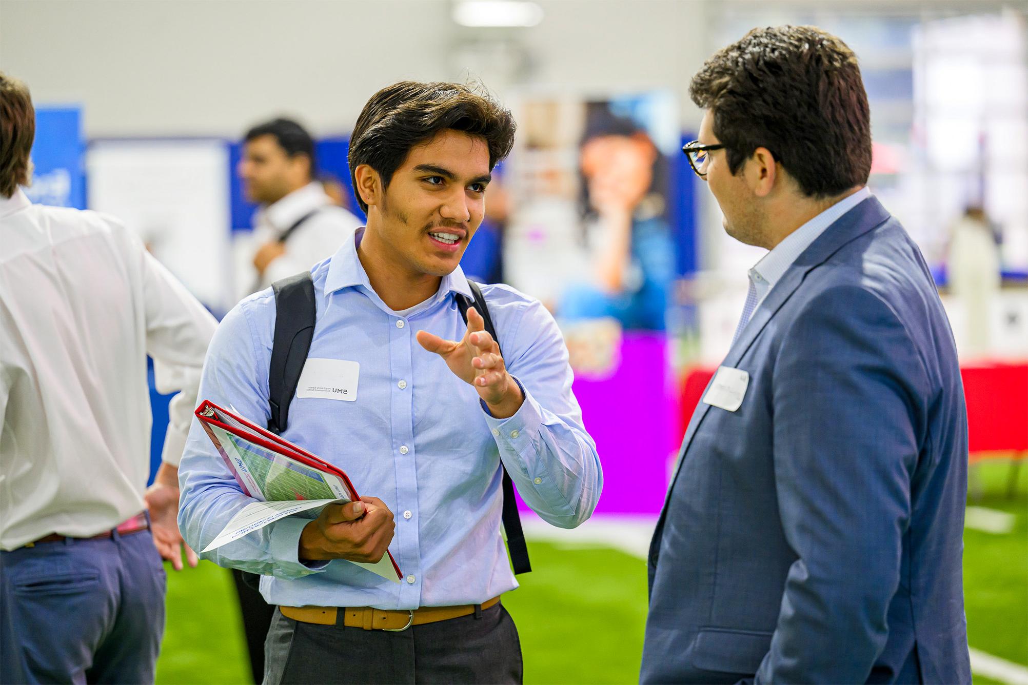 student talking with employer at Career Fair