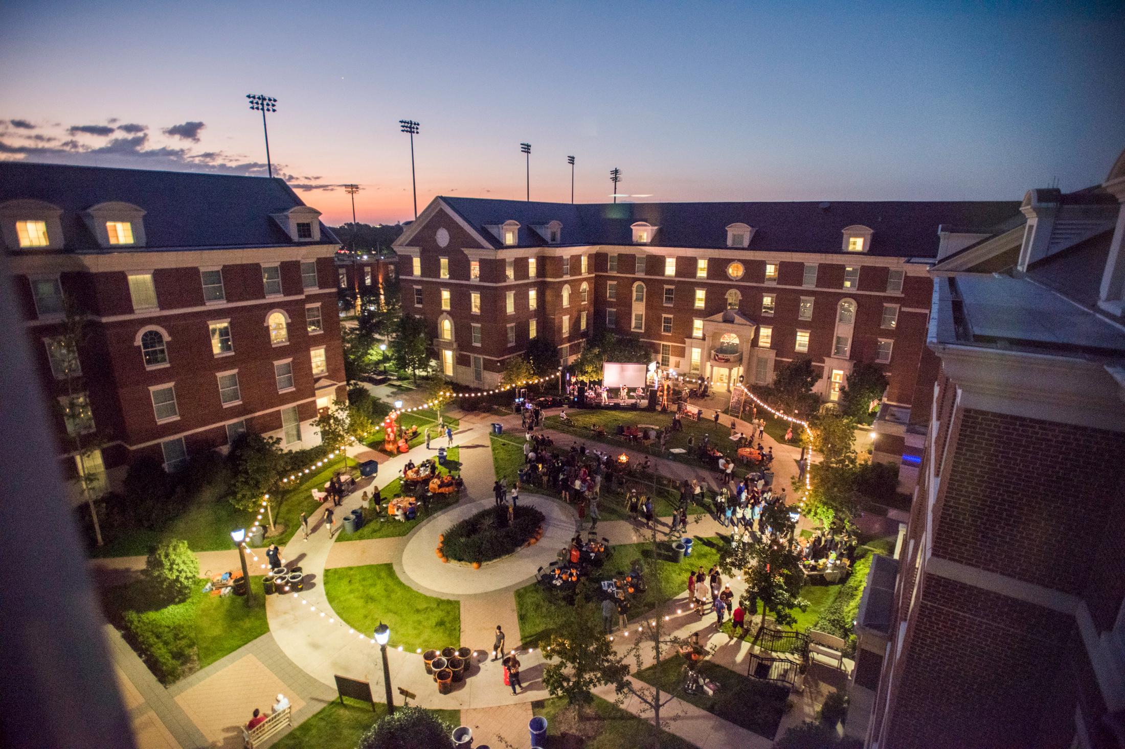 Kathy Crow Commons lawn nighttime arial shot of event